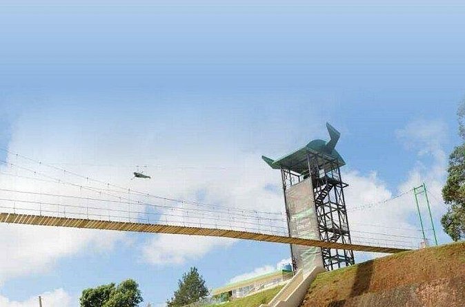 Conquer the Skies: Monster Zipline at Toro Verde Adventure Park - Crossing the suspension bridge to the Monster