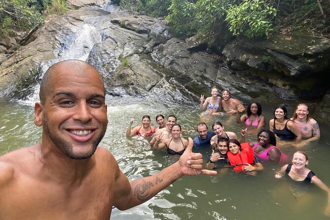 El Yunque & Beach Tour: Waterslide, Waterfall, Food, & Photos - A natural waterslide with real river power