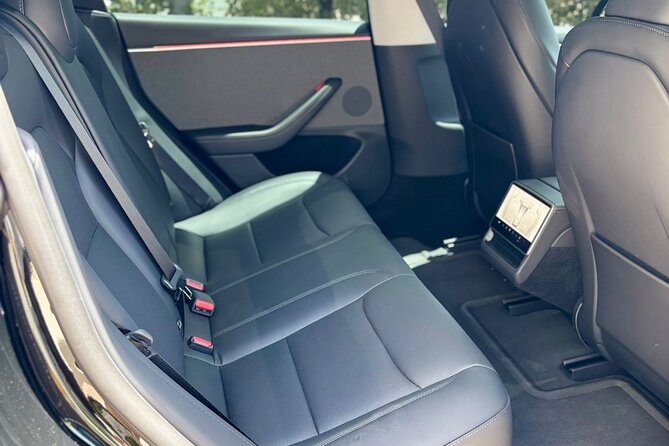 Puerto Rico Island Wide Private Transfers, Tesla 3 Luxury Sedan. - From baggage claim to the waiting car