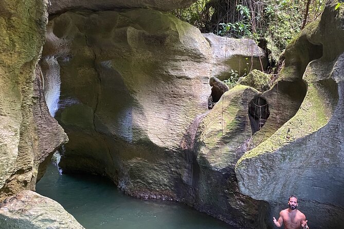 Rainforest Caves and Waterfalls Exploration with Transportation - Inside the caves, with water and headlamps