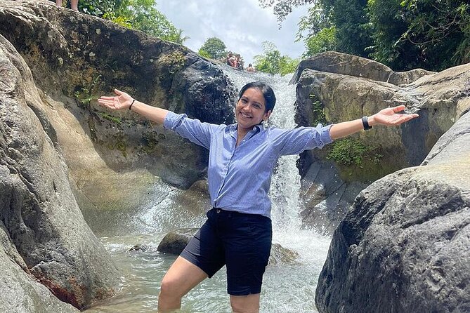 Rainforest Zipline, Luquillo Beach, and Natural Springs Day Trip - Natural springs and rock slides in El Yunque country