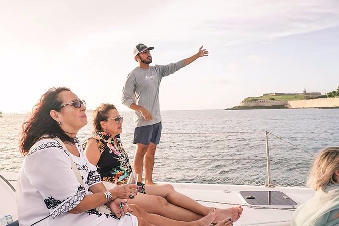San Juan Catamaran Sunset Sail with Drinks Included - A small catamaran and a big San Juan view