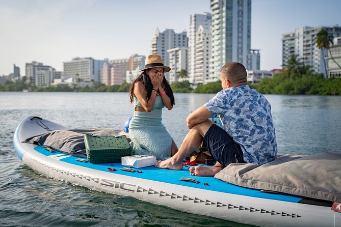San Juan — Private Floating Picnic Experience in Condado Lagoon - Settling onto the rose-petal raft