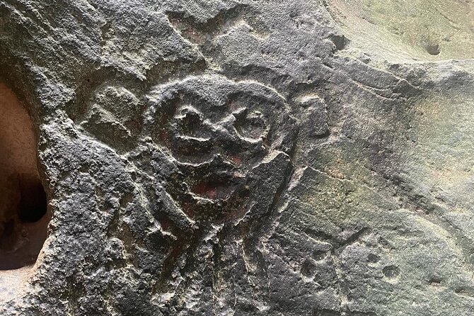 Taino Indian Cave, Arecibo Hike and Beach Tour from San Juan - Entering the cave and seeing Taíno carvings