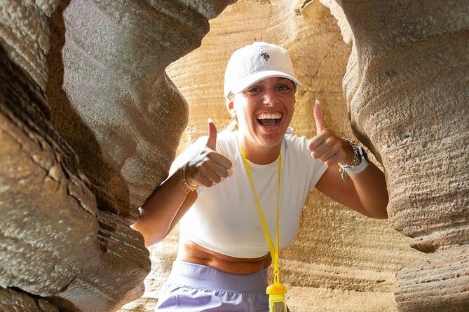 Taino Indian Cave, Arecibo Hike and Beach Tour from San Juan - Reaching Cueva del Indio over rough coastal rock